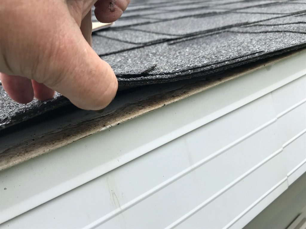 Roof inspection on a damaged house