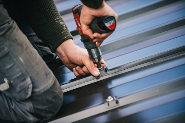 A pair of tin snips being used to make precise cuts on metal roofing, demonstrating how to cut metal roofing accurately.